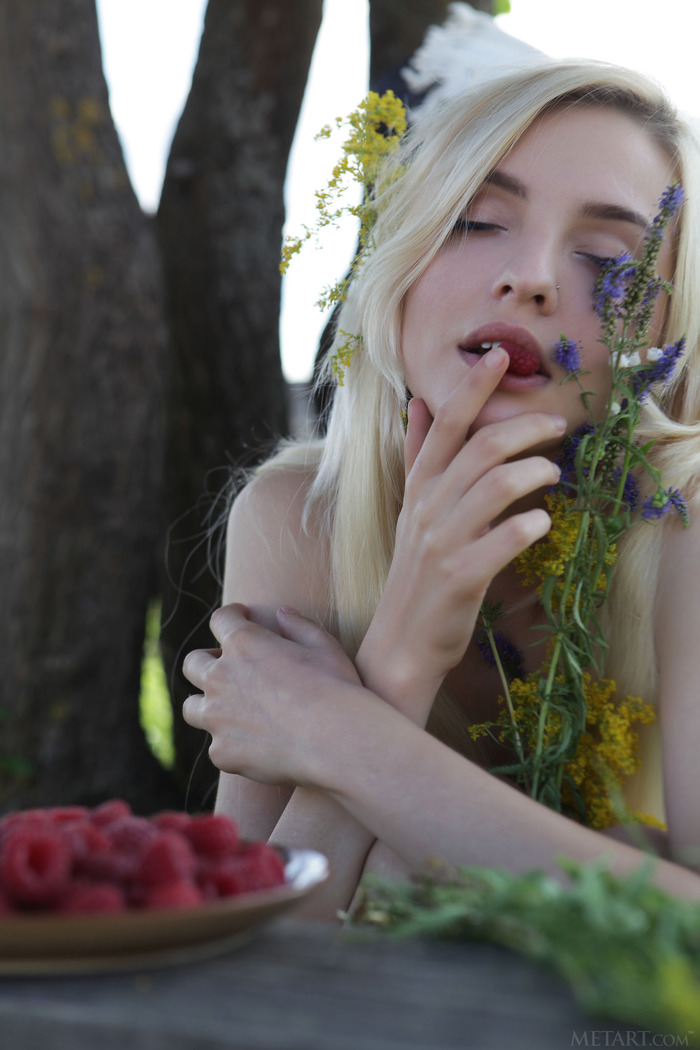  she devours a succulent raspberry between her luscious lips