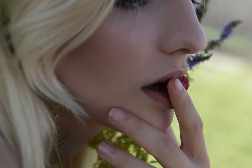  she devours a succulent raspberry between her luscious lips