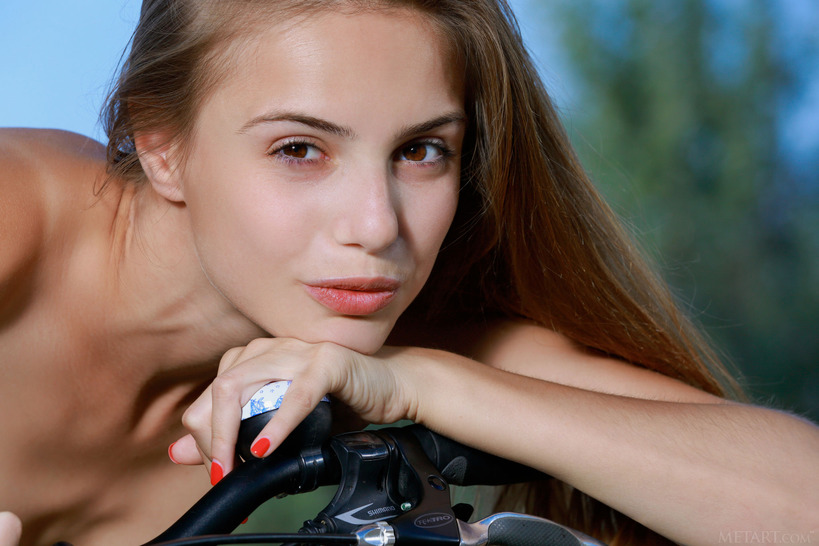 Topless cycling is one of gorgeous Elle Tan’s favorite pastimes